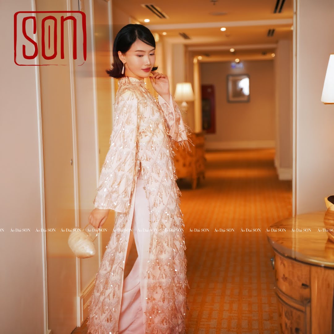 "Thuoc Son sequined Ao Dai set in blush pink silk, traditional Vietnamese dress"