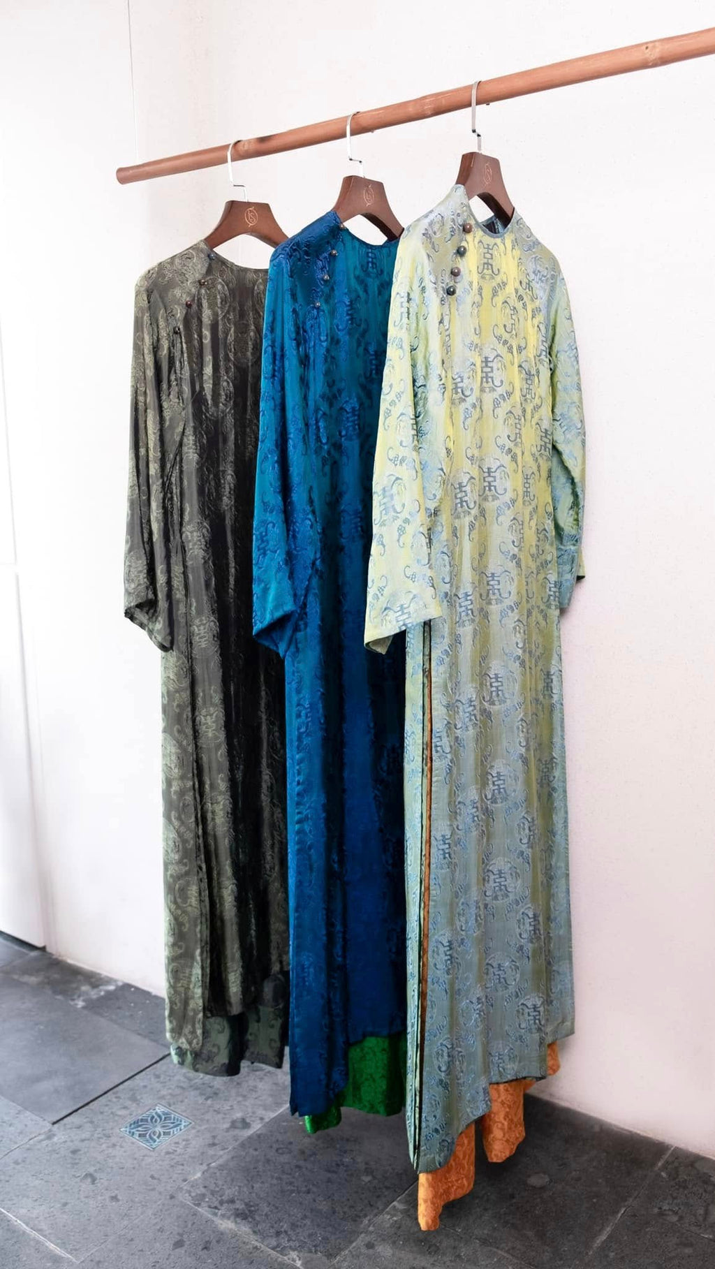 Celestial Indigo luxury áo dài lifestyle shot showcasing imperial teal color and elegant drape - Lo Boutique collection
