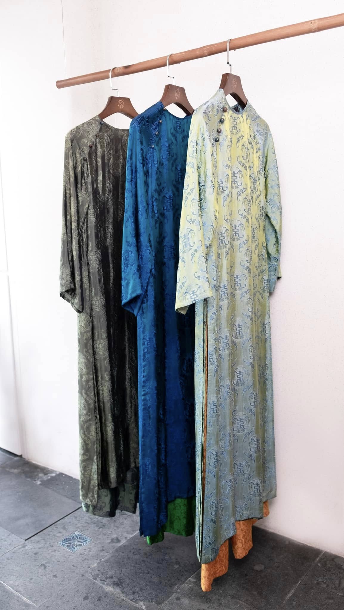 Celestial Indigo luxury áo dài lifestyle shot showcasing imperial teal color and elegant drape - Lo Boutique collection