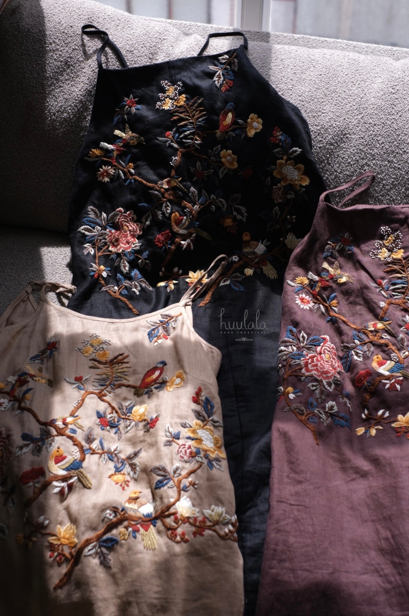 "Song bird" embroidered linen dress in beige by Huulala, featuring artisan floral and bird patterns.