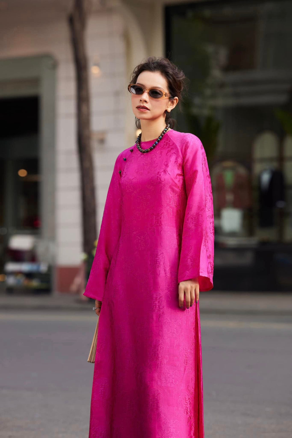 Fuchsia Reverie áo dài set showcasing bold color contrast with emerald green silk peacock pattern pants from Mộc