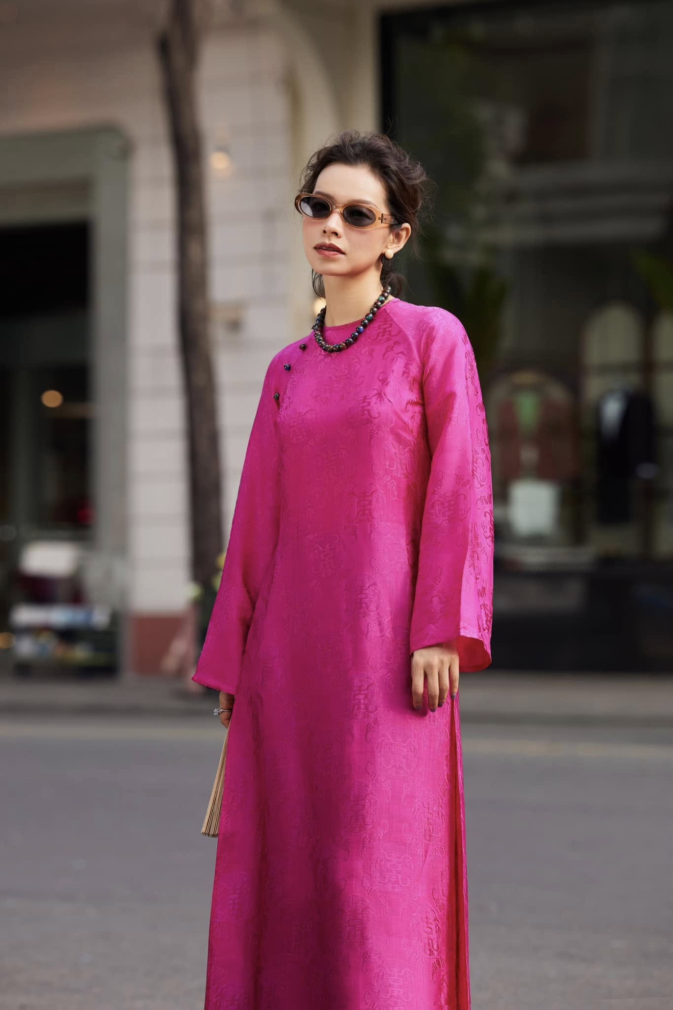Fuchsia Reverie áo dài set showcasing bold color contrast with emerald green silk peacock pattern pants from Mộc