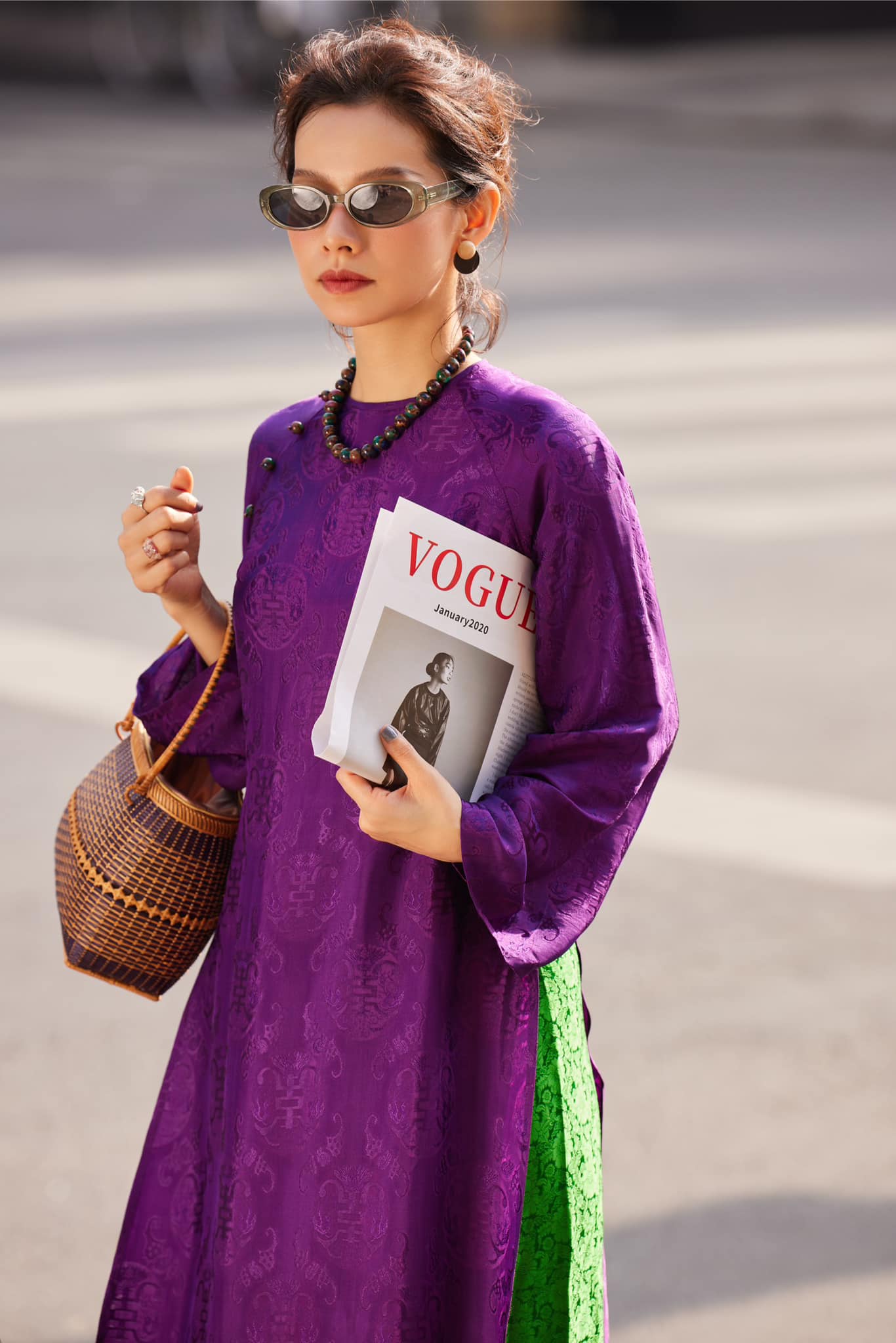 Woman wearing Royal Amethyst deep purple áo dài with stone buttons and elegant Vietnamese tailoring - luxury cultural fashion
