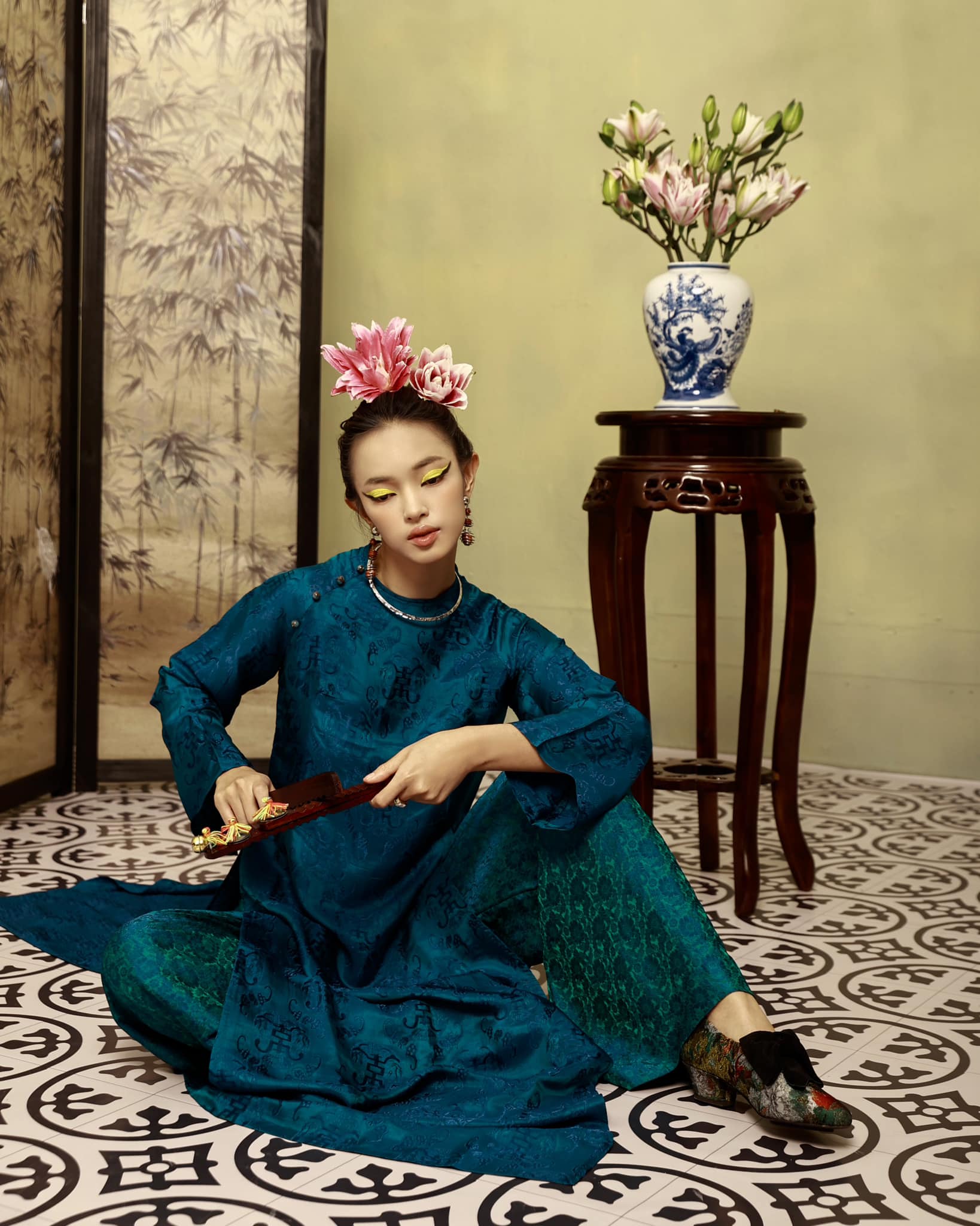 Detail view of Celestial Indigo wormsilk fabric with woven Lộc Thọ symbols and premium texture - Vietnamese artisan craftsmanship