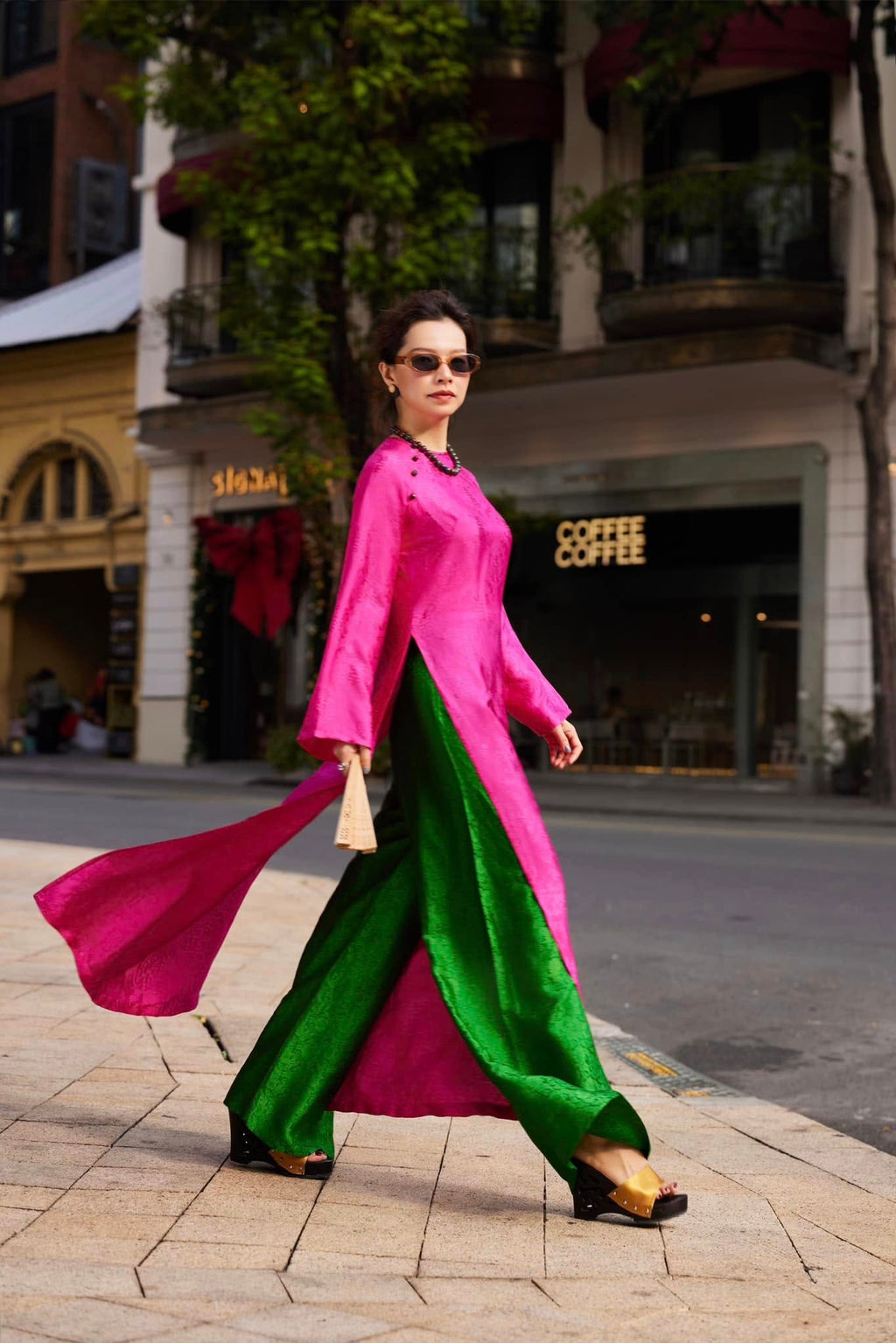 Full ensemble Fuchsia Reverie áo dài with dramatic emerald pants creating striking Vietnamese traditional fashion statement
