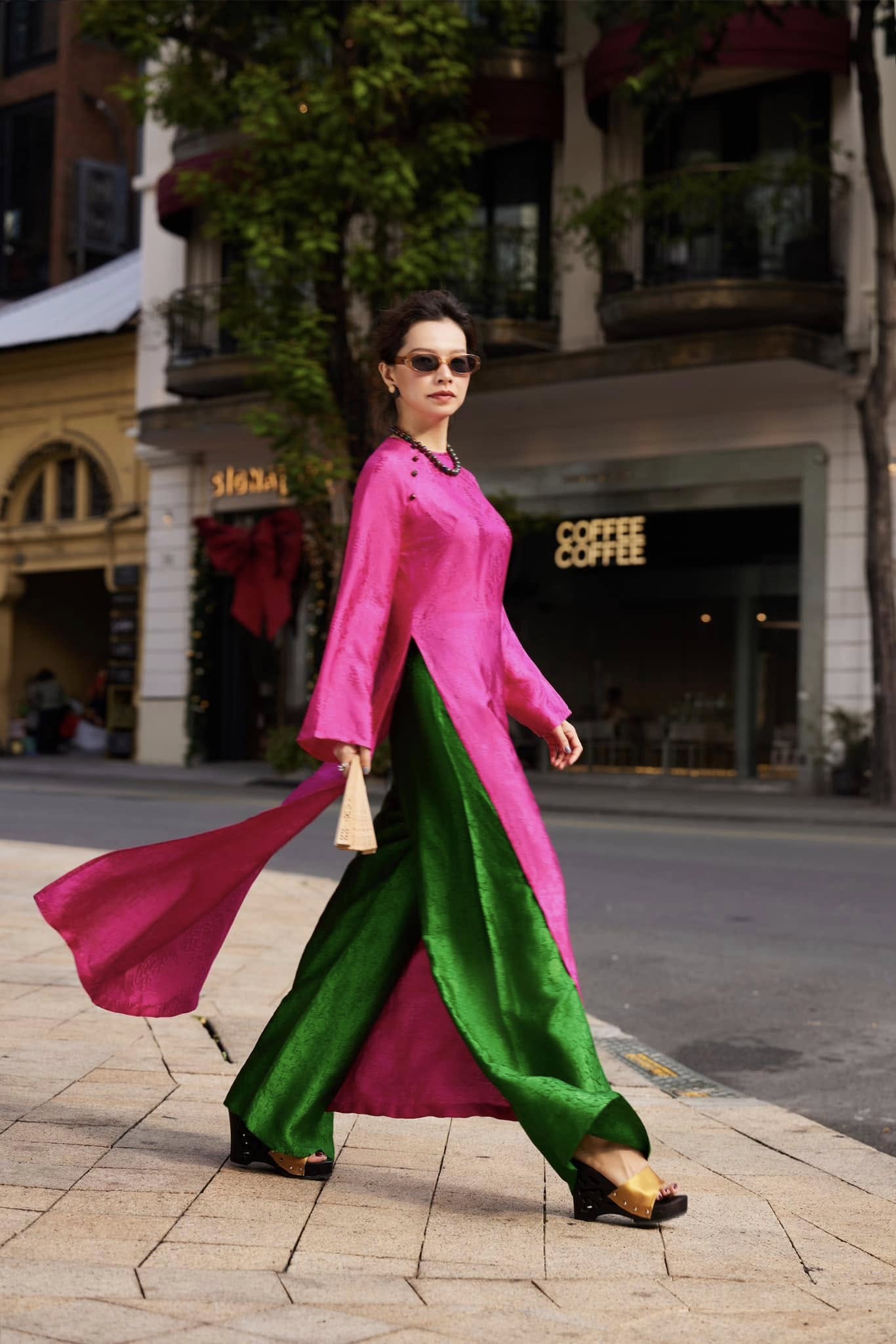 Full ensemble Fuchsia Reverie áo dài with dramatic emerald pants creating striking Vietnamese traditional fashion statement