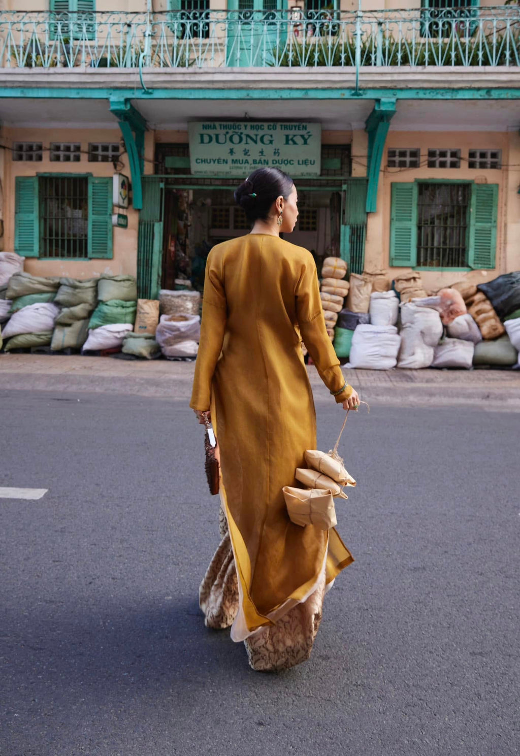 Golden Grace – Hand-Embroidered Silk Áo Dài by Lo Boutique by Lo Boutique - close-up of premium wormsilk fabric and artisan craftsmanship, premium Vietnamese wormsilk clothing