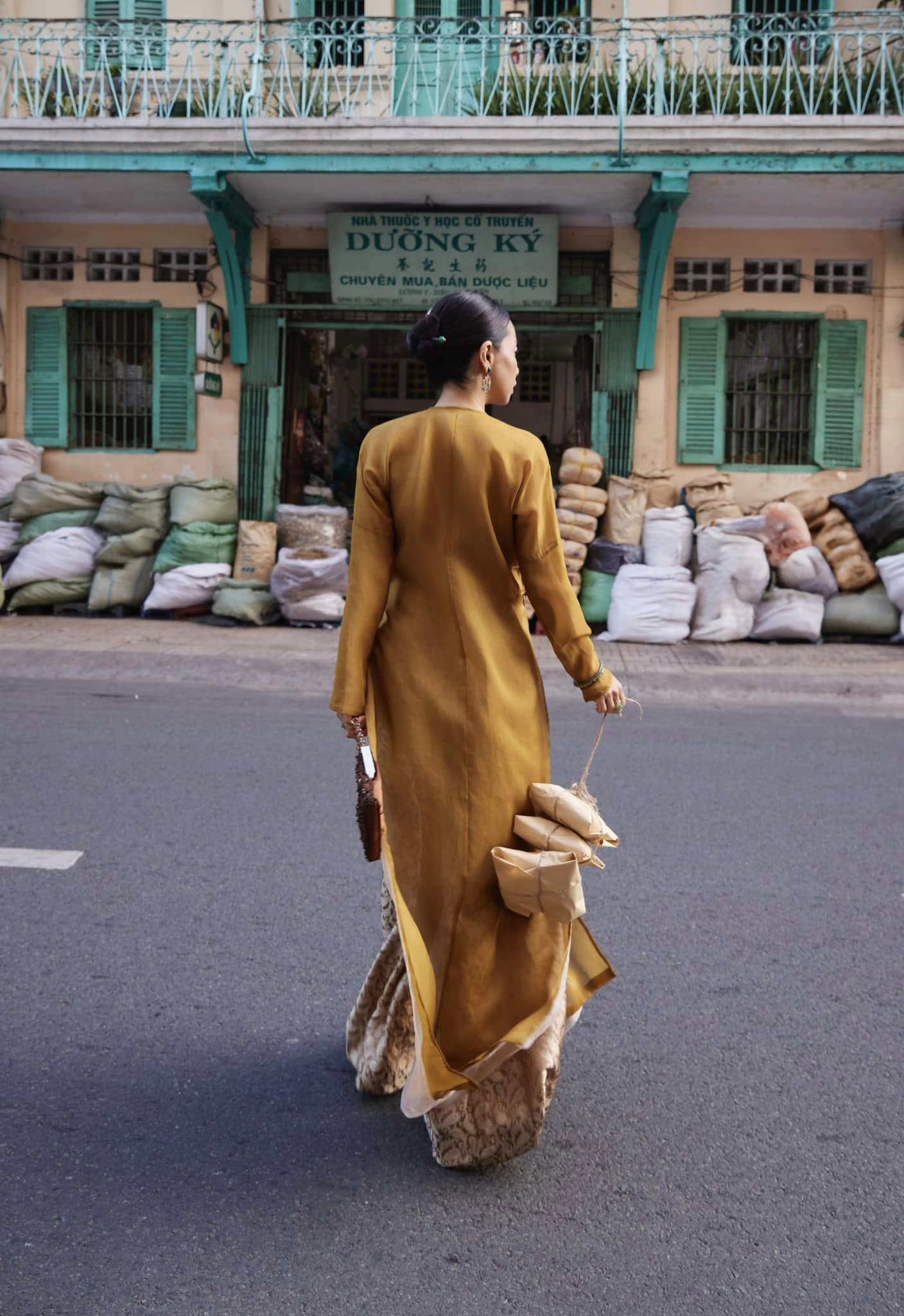 Golden Grace – Hand-Embroidered Silk Áo Dài by Lo Boutique by Lo Boutique - close-up of premium wormsilk fabric and artisan craftsmanship, premium Vietnamese wormsilk clothing