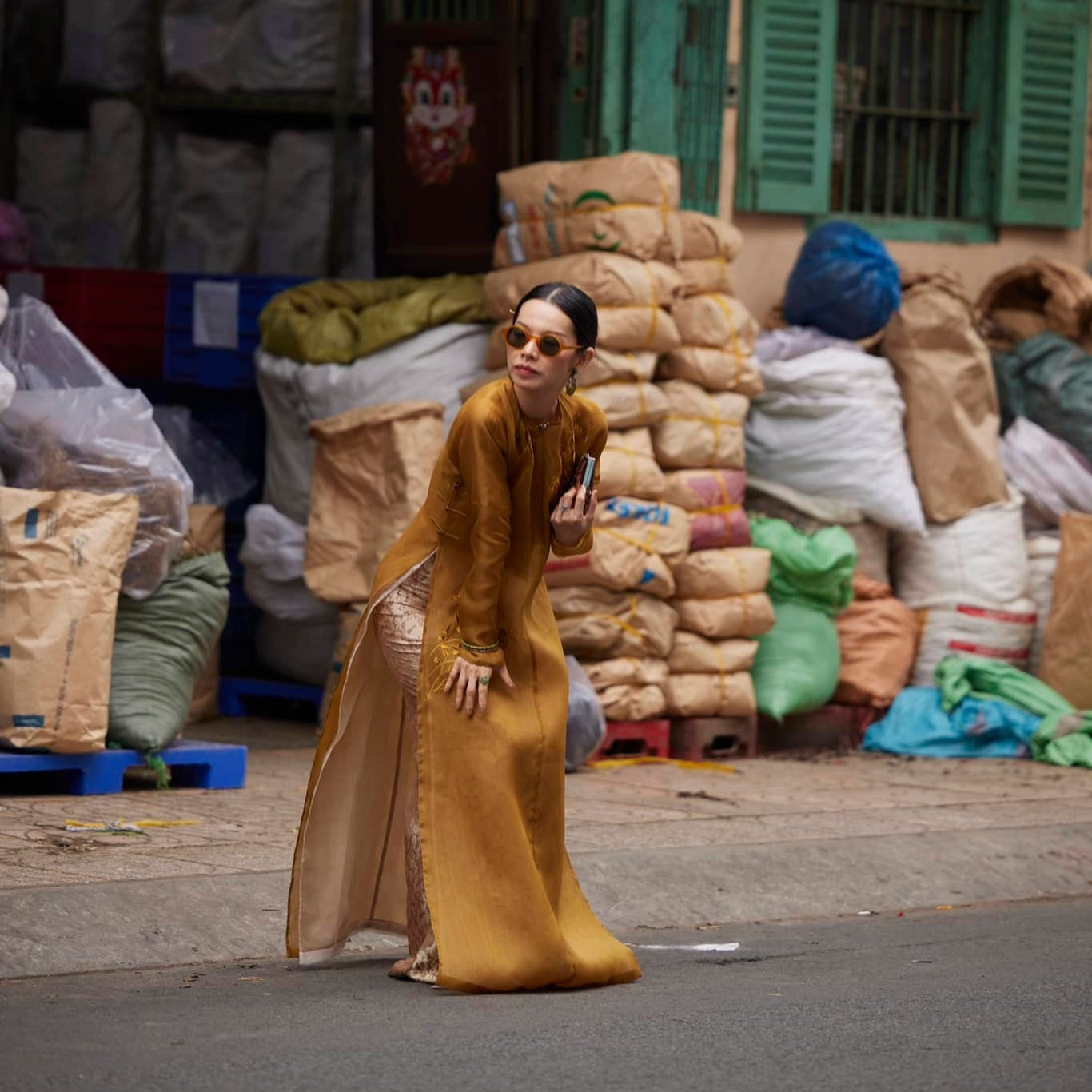Golden Grace – Hand-Embroidered Silk Áo Dài by Lo Boutique by Lo Boutique - styled lifestyle shot demonstrating Vietnamese luxury fashion, premium Vietnamese wormsilk clothing