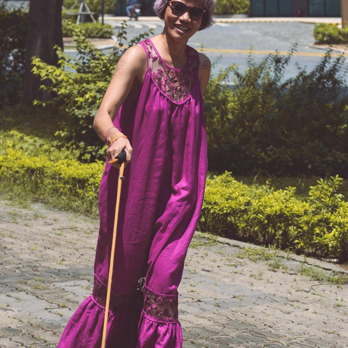"Magnolia Linen and Lace Maxi Dress in Magenta by Turmeric, red floral pattern, sleeveless design."