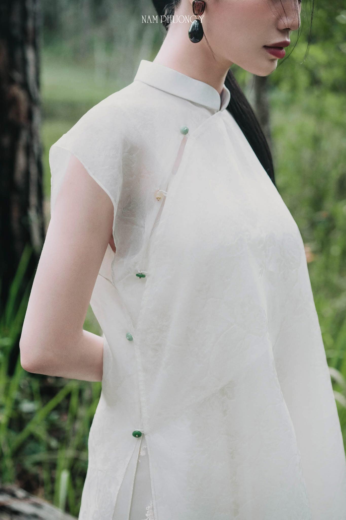 "Premium 'Nhat Lien' Ao dai set in white silk by Nam Phuong Y, traditional Vietnamese dress."