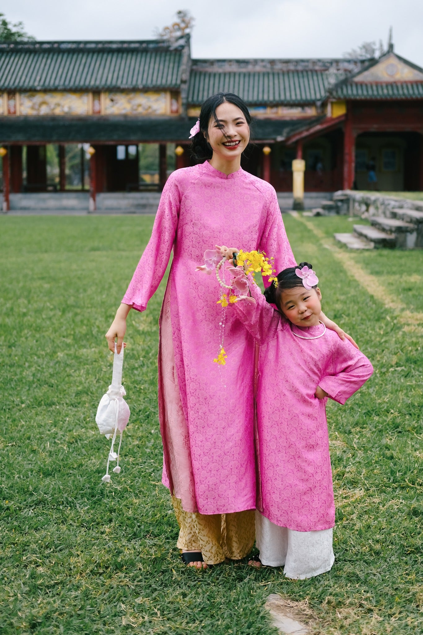 “Cuc Hoa” -  premium Ao Dai Set  for kids in Pink by Lo Boutique - side view highlighting elegant silhouette and luxury fabric, premium Vietnamese wormsilk clothing