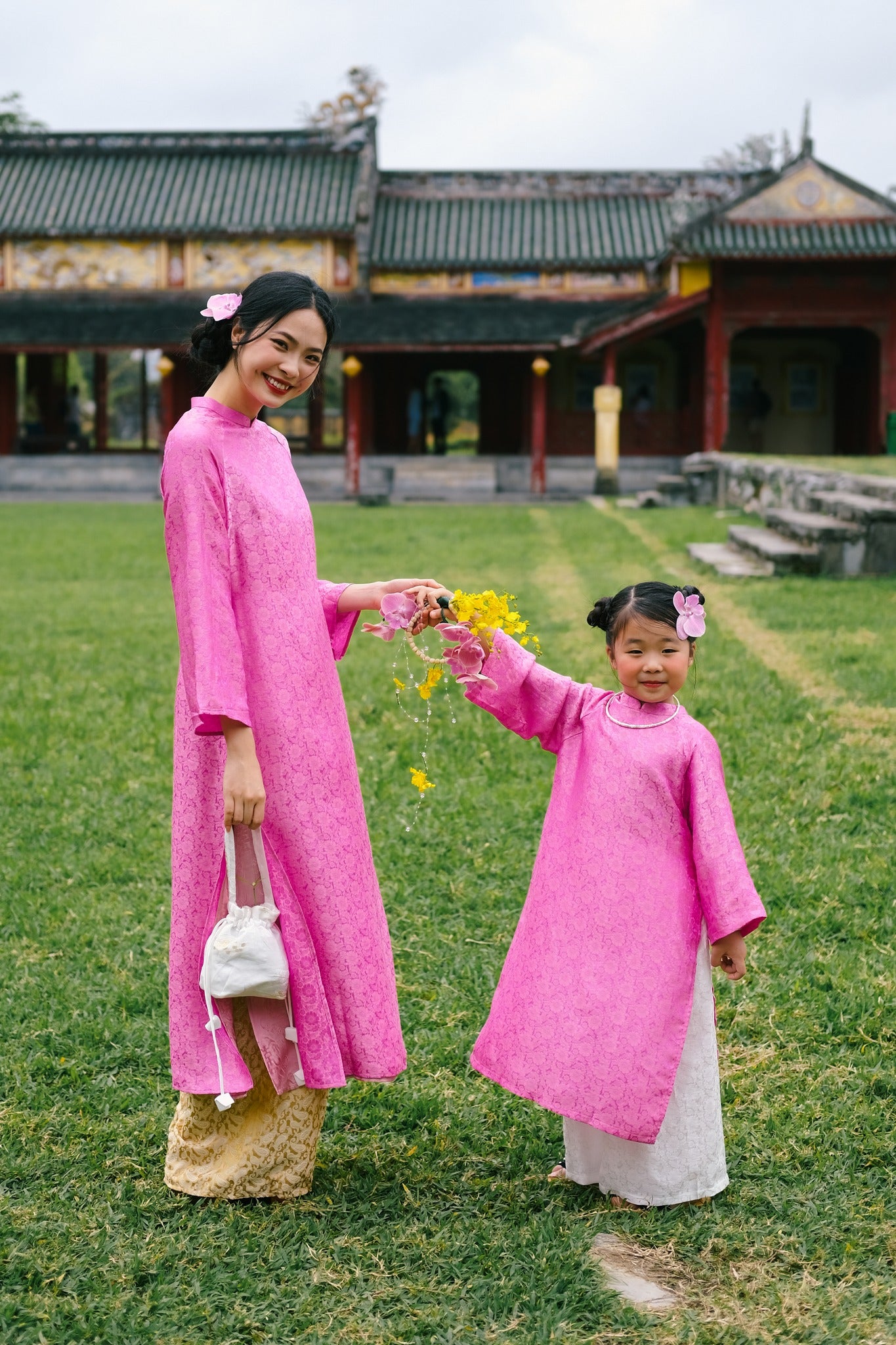 “Cuc Hoa” -  premium Ao Dai Set  for kids in Pink by Lo Boutique - back view showing intricate details and cultural authenticity, premium Vietnamese wormsilk clothing