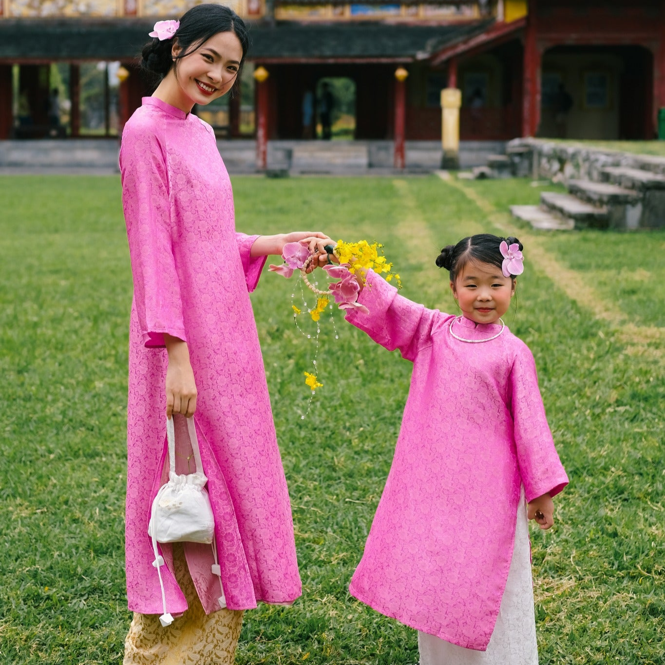 “Cuc Hoa” -  premium Ao Dai Set  for kids in Pink by Lo Boutique - front view showcasing traditional Vietnamese áo dài design, premium Vietnamese wormsilk clothing