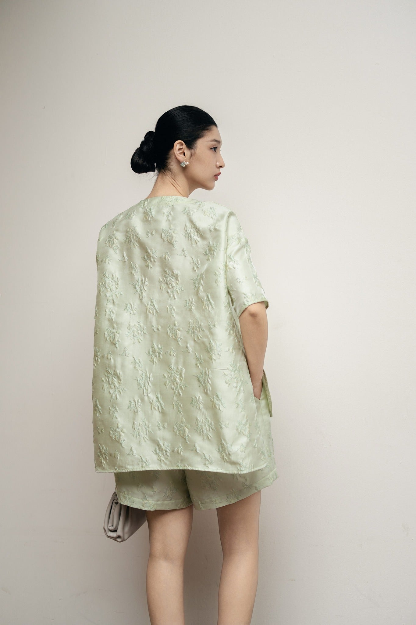 "Tiểu Mai Set – Mandarin-neck top and shorts in pastel green silk jacquard with floral pattern, Vietnamese fashion by Hy Phuong."