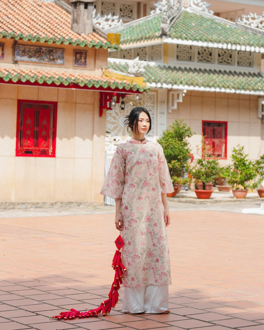 "Thieu Hoa Jacquard Ao Dai Set in Pink, traditional Vietnamese dress with floral silk embroidery, cultural heritage attire."