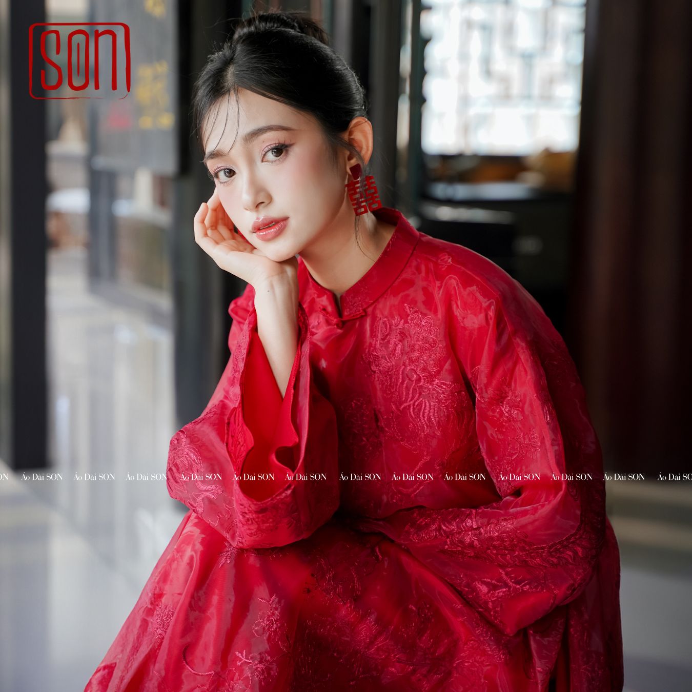 "Uyen Son" red embroidered silk Ao dai, traditional Vietnamese dress with floral patterns.