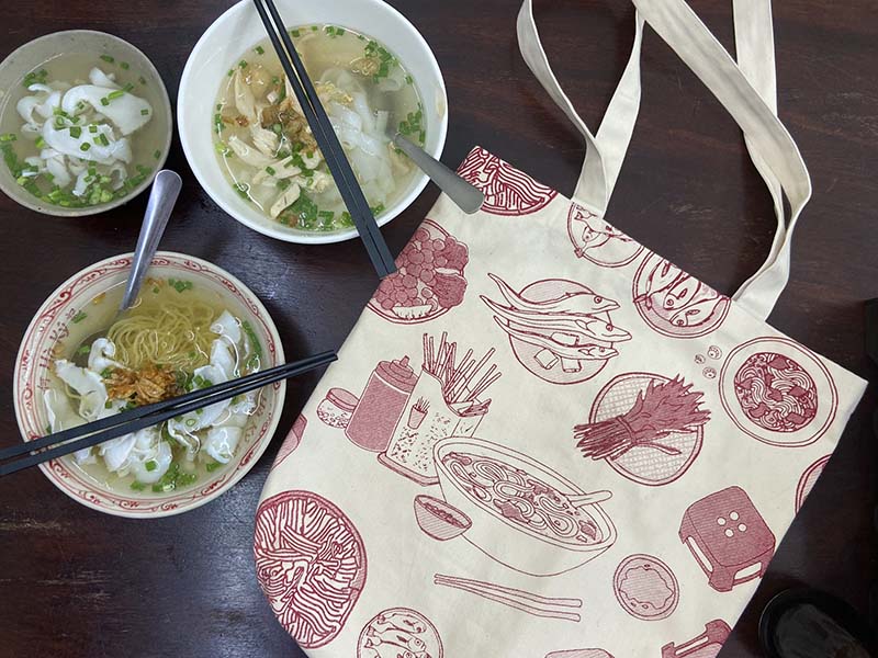 "Vietnam in a Bowl" coaster set of 6 by Bat-trang, featuring red traditional Vietnamese food illustrations.