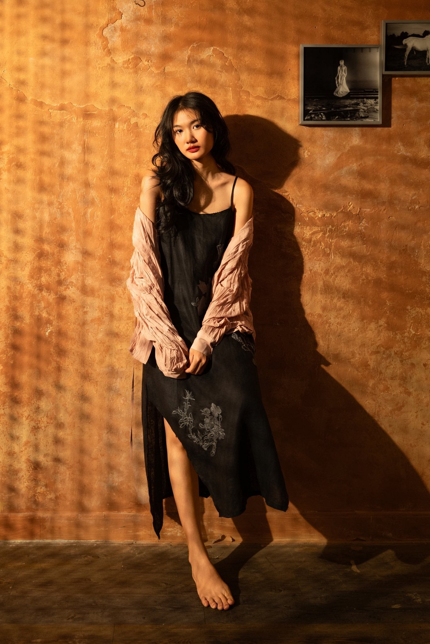 "Magnolia embroidered linen slip dress in noir by Huulala, black with floral pattern"