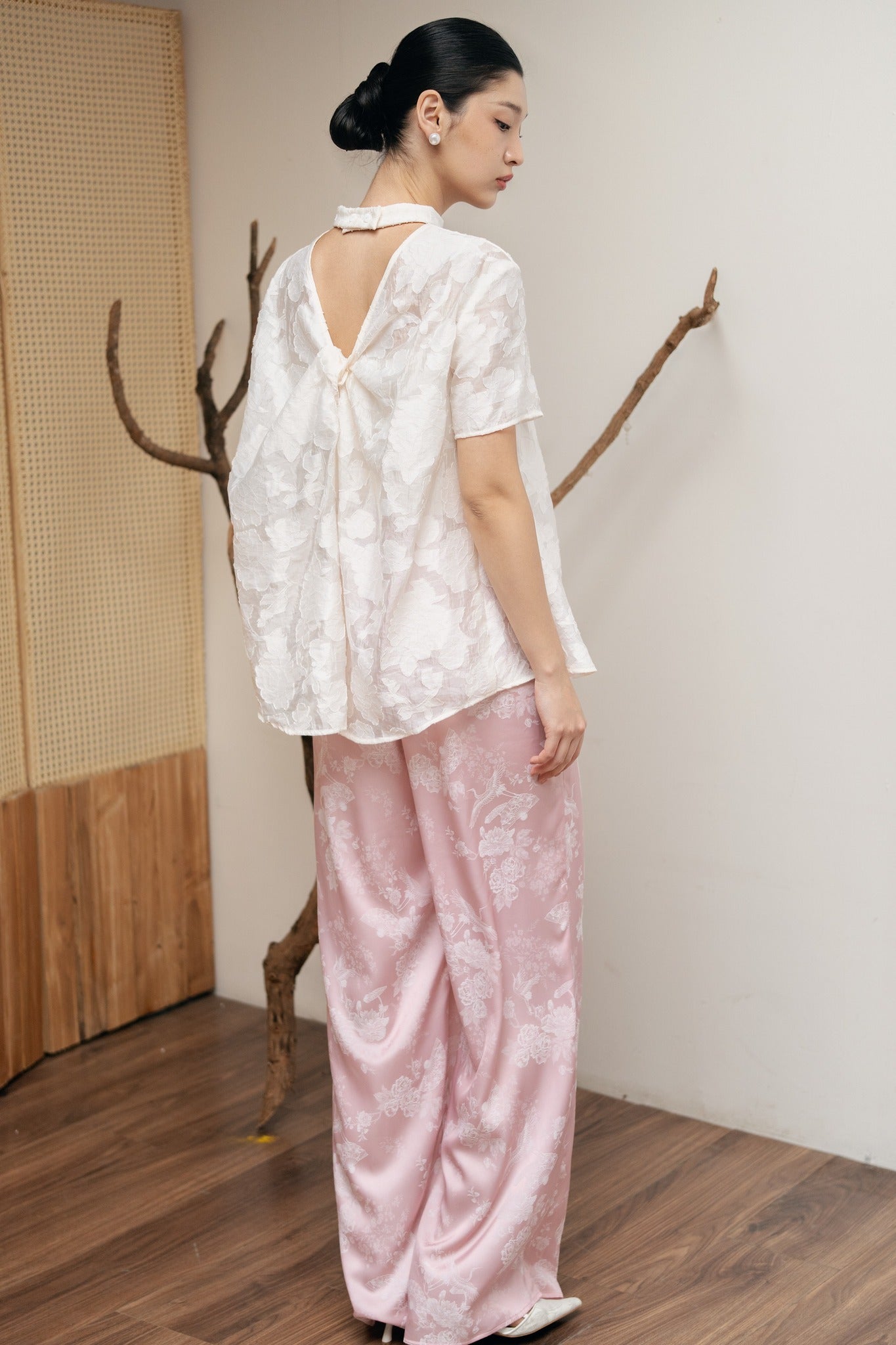 "Lam Khue Jacquard Silk Mandarin-Neck Top in Pastel Pink, traditional Vietnamese design with floral pattern by Hy Phuong."