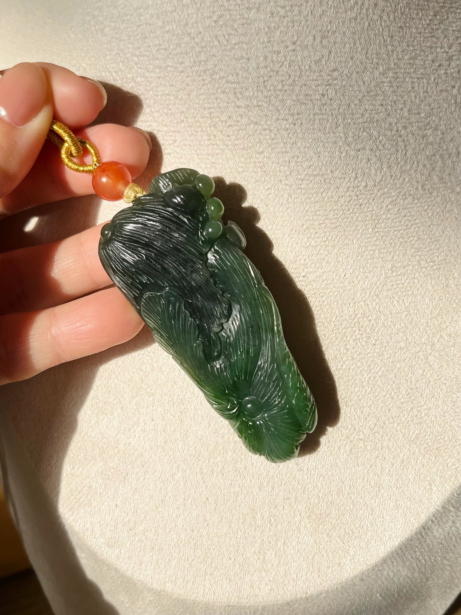 “Lotus Blessing ”- Hand Carved Green Hetian Jade Fish and Lotus Pendant, 手雕碧玉荷花鱼手把件 - detail close-up by L'Orient Haus