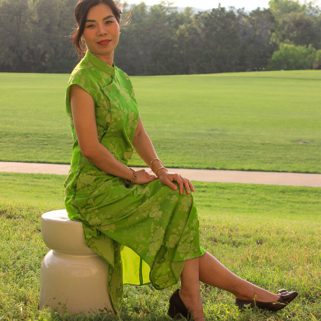 Hương Trầm - Sleeveless Cheongsam in Green with Jacquard weave - side profile by Hy Phuong
