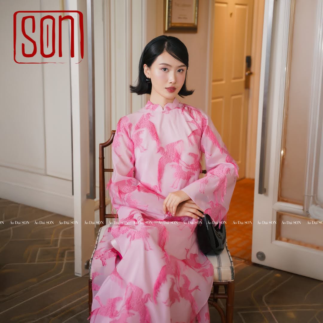 "Pink embroidered organza Ao Dai set 'Hac Son' by SON, traditional Vietnamese wedding dress."