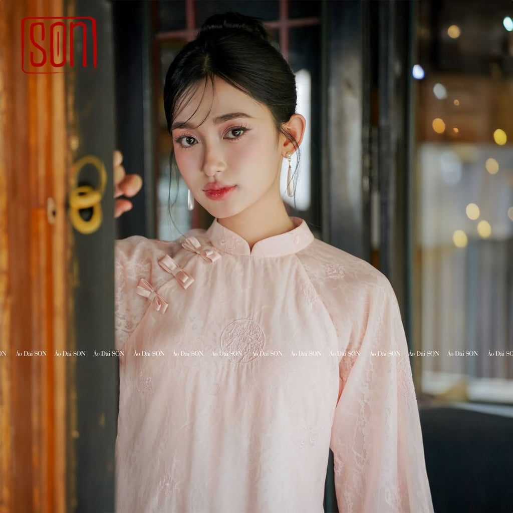 "To Son pink lacy Ao Dai set, traditional Vietnamese dress in jacquard, wedding collection."