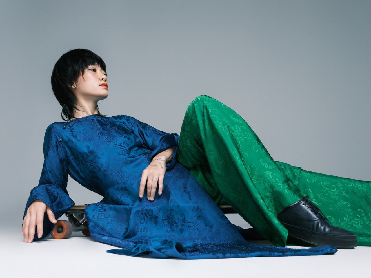Celestial Indigo luxury áo dài lifestyle shot showcasing imperial teal color and elegant drape - Lo Boutique collection