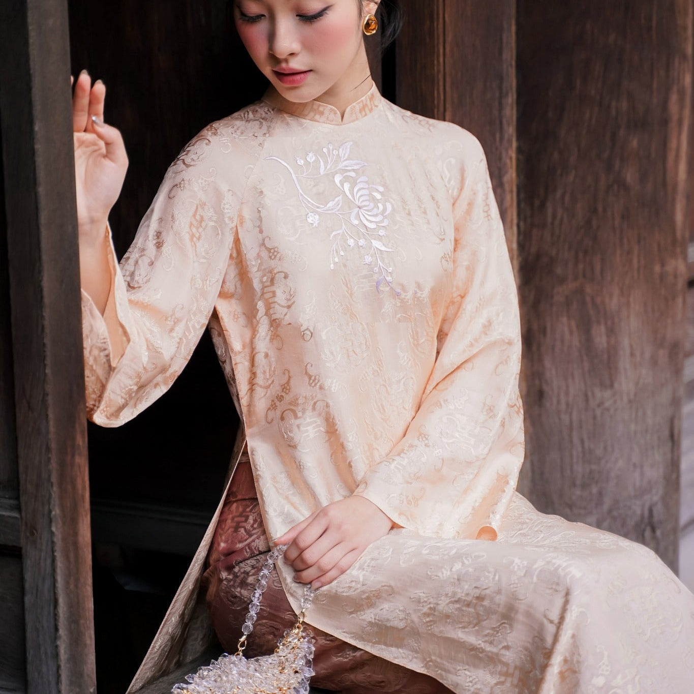 Vietnamese Ao Dai - Khanh Chi Ao Dai Set - Embroidery on wormsilk in Peach Sand - front view in beige by Tam