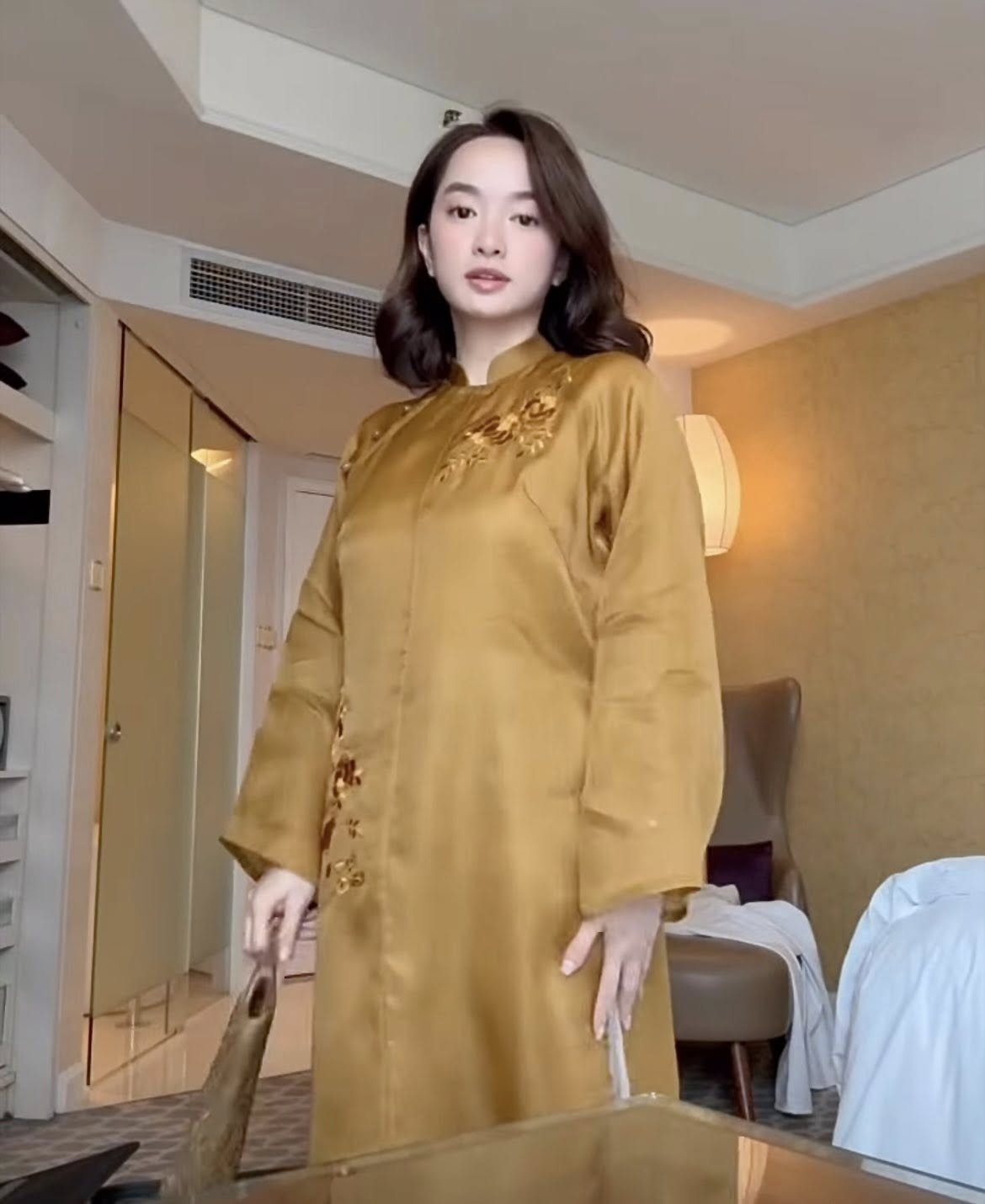 Golden Grace – Hand-Embroidered Silk Áo Dài by Lo Boutique by Lo Boutique - detail shot of Lộc Thọ symbols and traditional Vietnamese motifs, premium Vietnamese wormsilk clothing