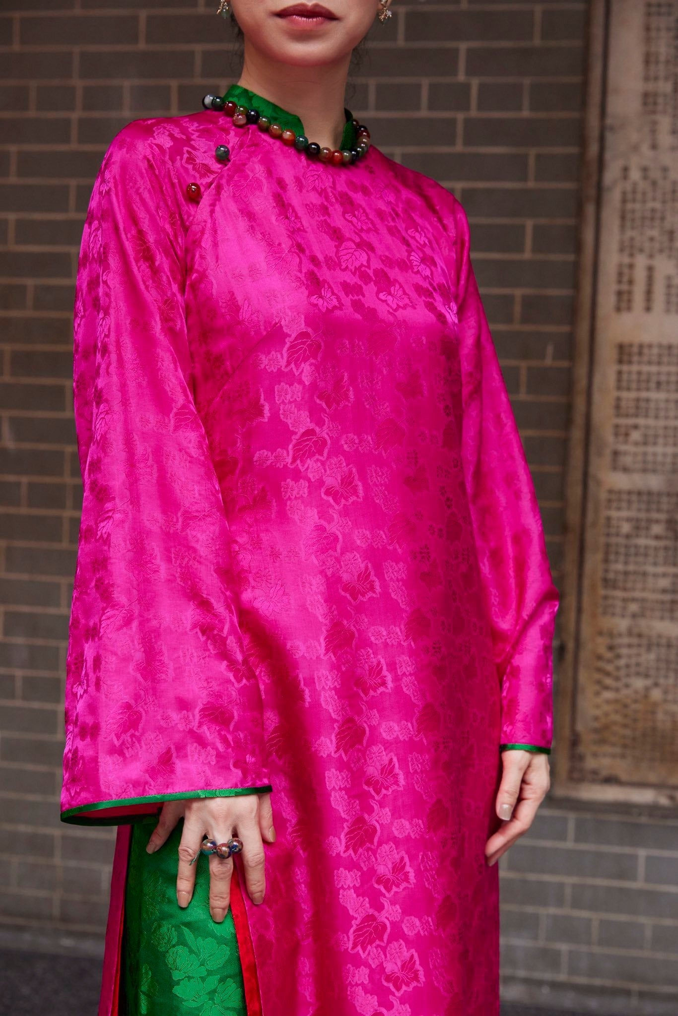 Lễ Hoa – Premium Silk Brocade Áo Dài in Fuchsia & Jade by Lo Boutique - close-up of premium wormsilk fabric and artisan craftsmanship, premium Vietnamese wormsilk clothing