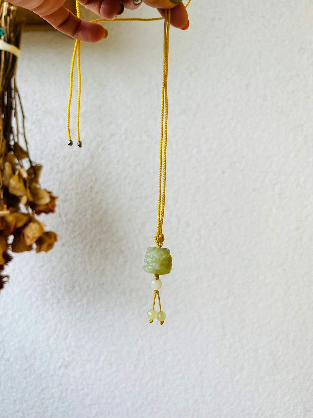 Guardian's Fortune – Hand-Carved Hetian Jade Lion Dance Charm - detail close-up by L'Orient Haus