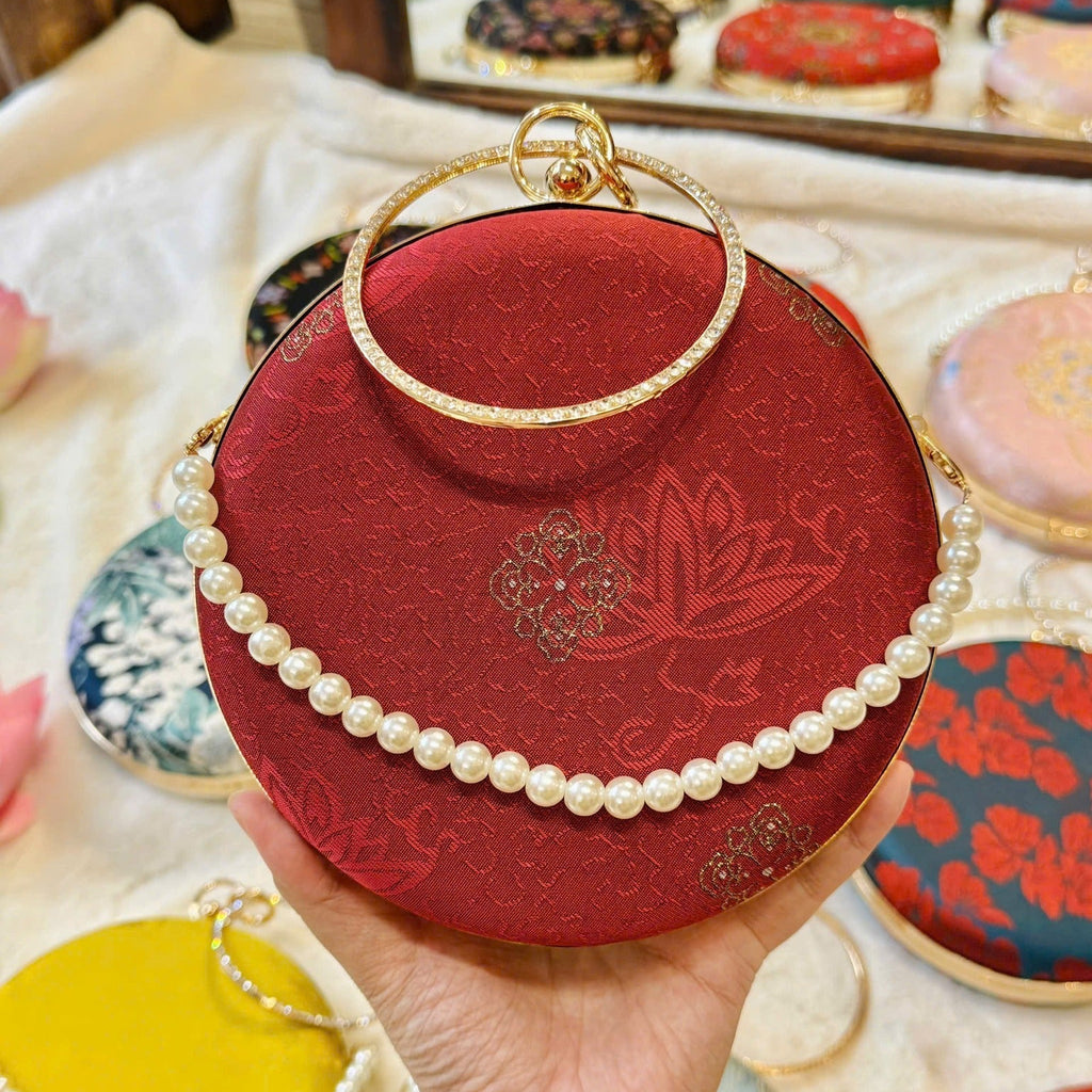 “Nguyệt Tú” – Silk Round Clutch with Metal Handle in Red Pattern - detail close-up by Moc - Bags