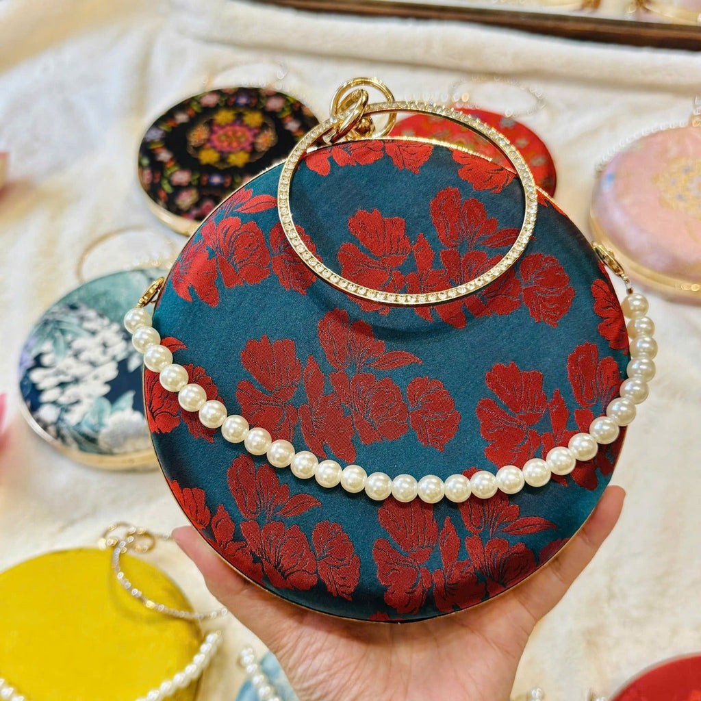 “Nguyệt Tú” – Wormsilk Silk Round Clutch with Metal Handle in Blue/Red - front view | Vietnamese Luxury Fashion