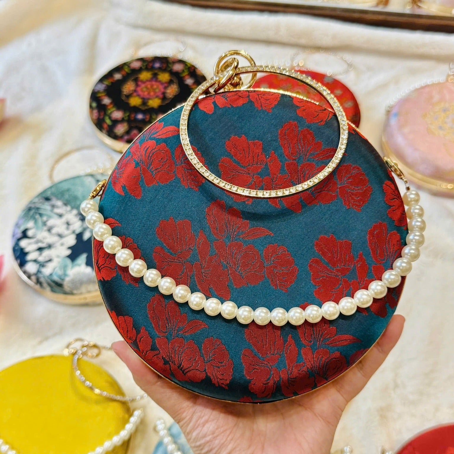 “Nguyệt Tú” – Wormsilk Silk Round Clutch with Metal Handle in Blue/Red - detail close-up by Moc - Bags