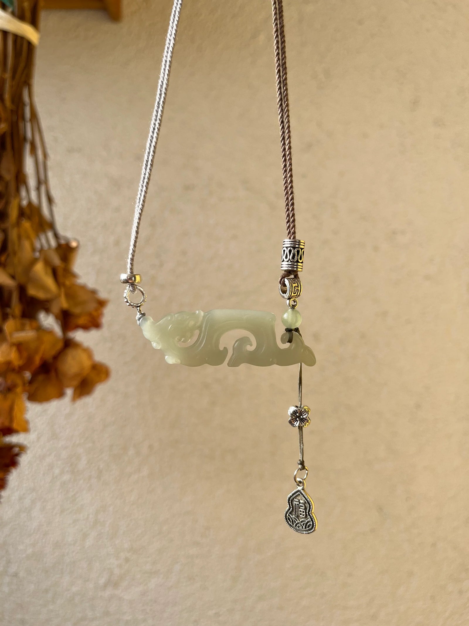 Traditional Motif - Celestial Dragon – Hand-Carved Nephrite Jade Necklace - side profile in green by L'Orient Haus