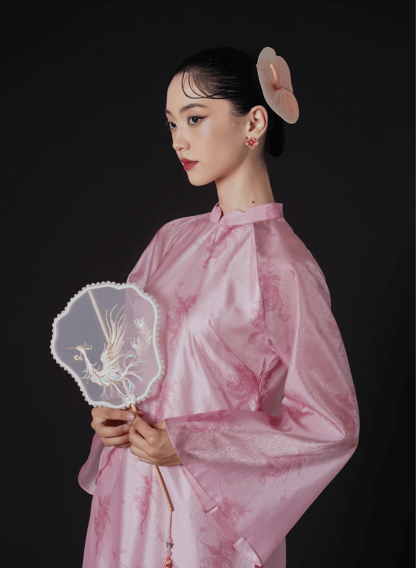 "Thy Loan Ao dai set by Lalin in light pink silk, traditional Vietnamese dress with modern pattern."