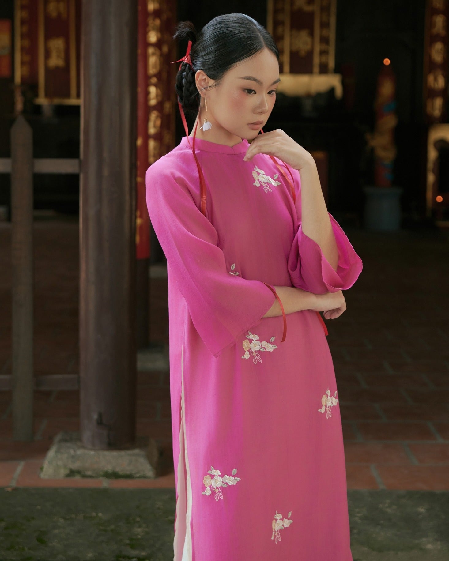 "Pink chiffon 'Kha Ai' Ao Dai set by Moc, traditional Vietnamese dress with floral silk pattern."
