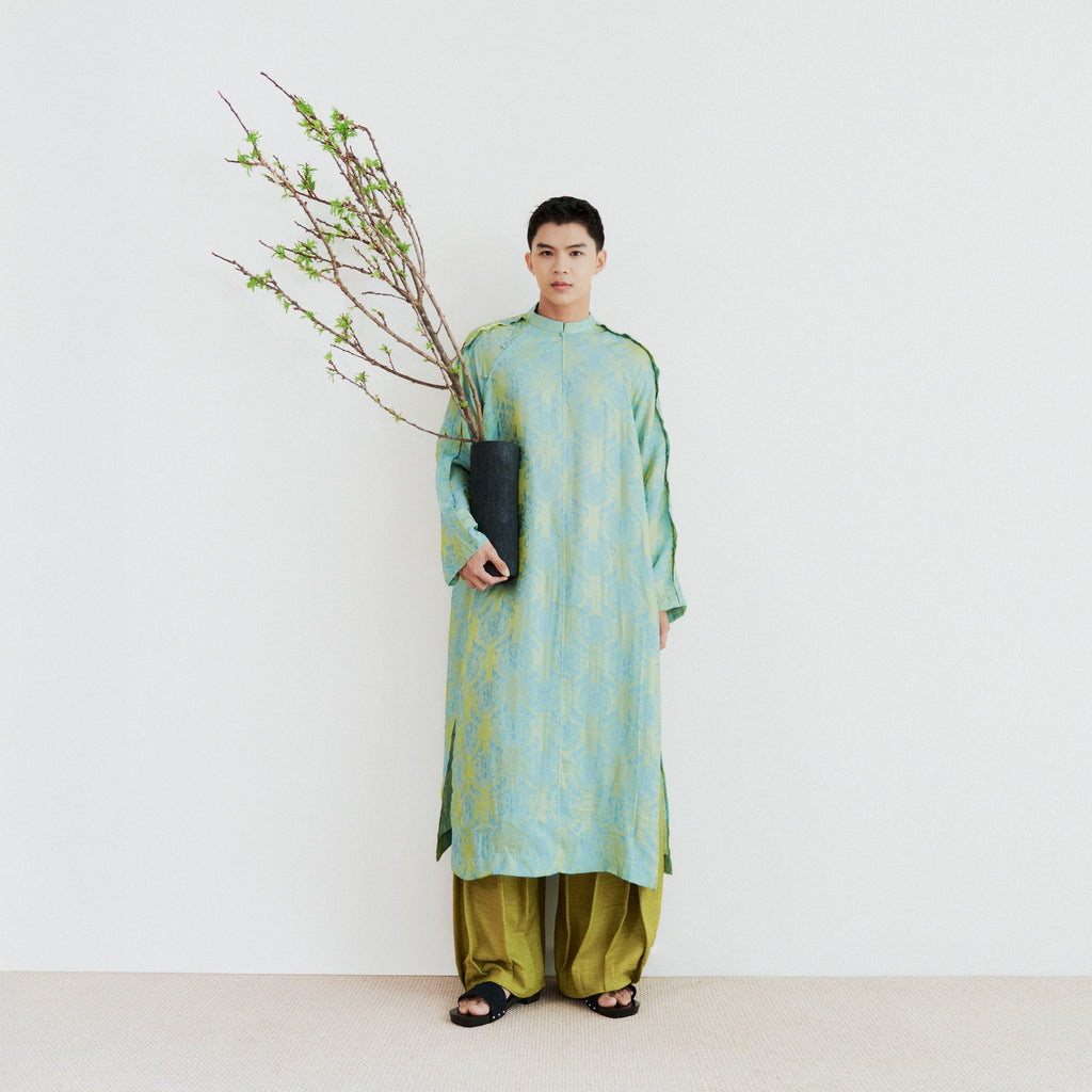 Vietnamese Ao Dai - Biec Men’s Áo Dài Set - Tencel Silk in Loc Tho pattern with raw-silk pants - front view in green by Lalin