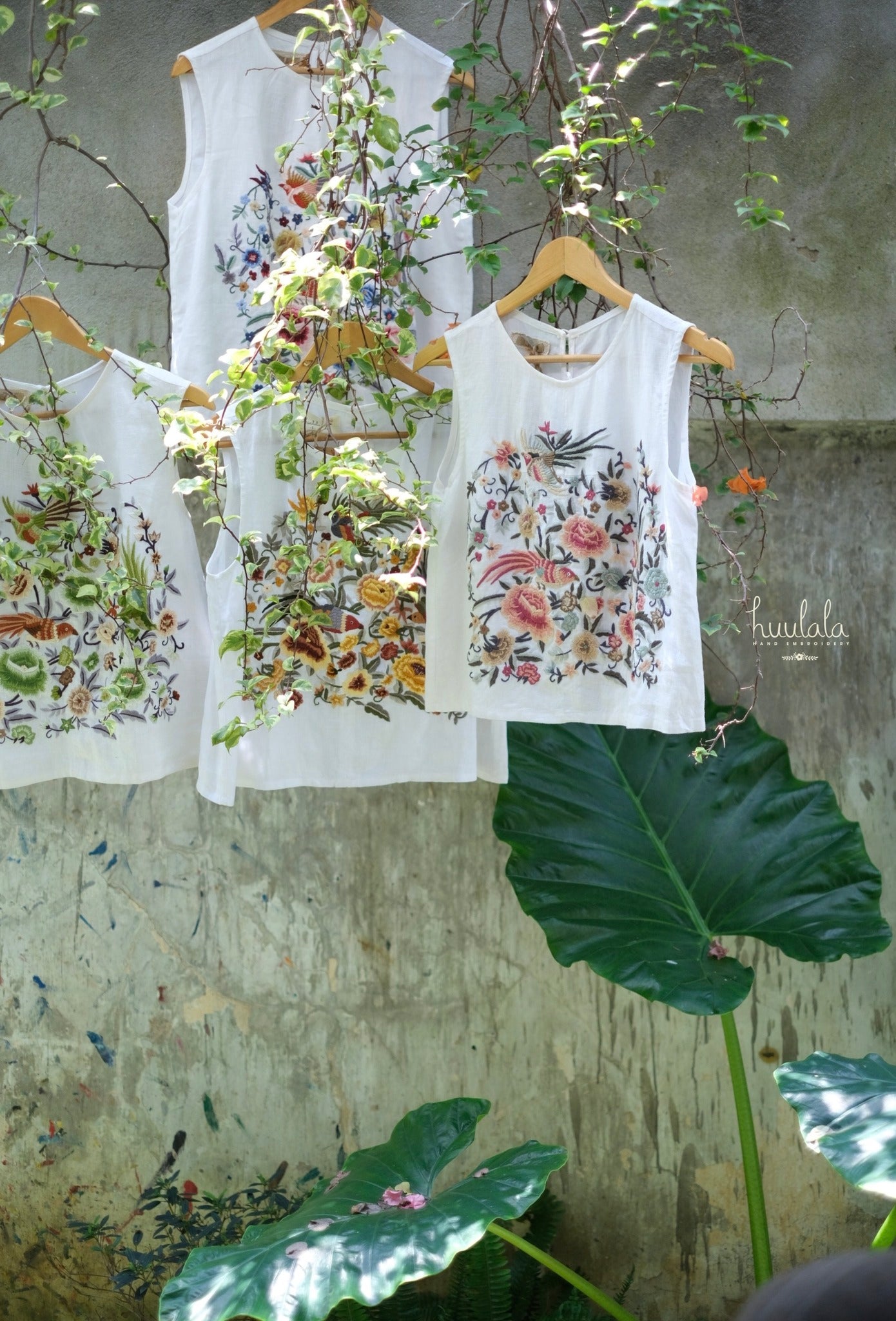 "Embroidered linen sleeveless top 'Kai' by Huulala, pink floral on white, artisan-crafted."