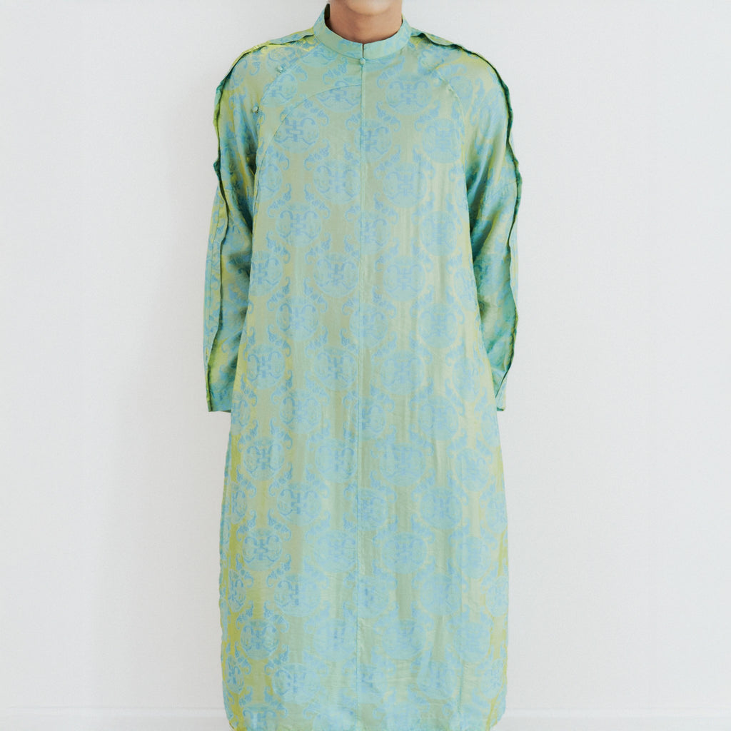Vietnamese Ao Dai - Biec Men’s Áo Dài Set - Tencel Silk in Loc Tho pattern with raw-silk pants - front view in green by Lalin