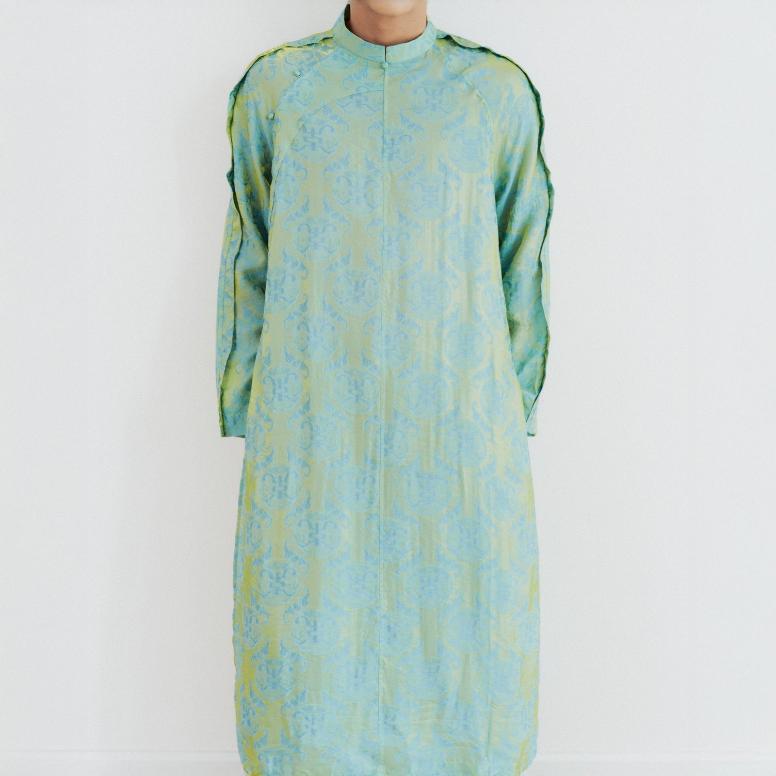 Vietnamese Ao Dai - Biec Men’s Áo Dài Set - Tencel Silk in Loc Tho pattern with raw-silk pants - front view in green by Lalin