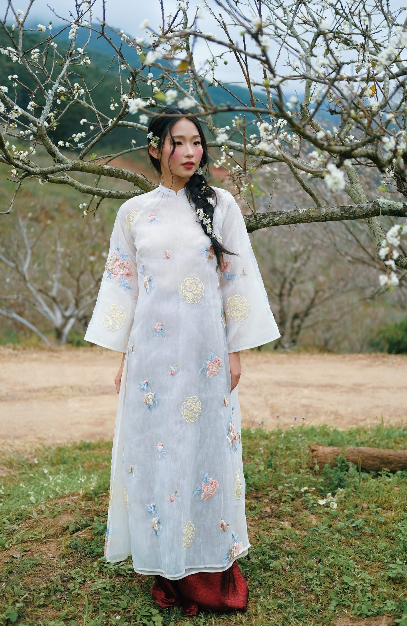 Vietnamese Ao Dai - Ngọc Như Ý Ao-dai Set – Embroidered Áo Dài Set in Soft Ivory - front view in organza in white by Moc