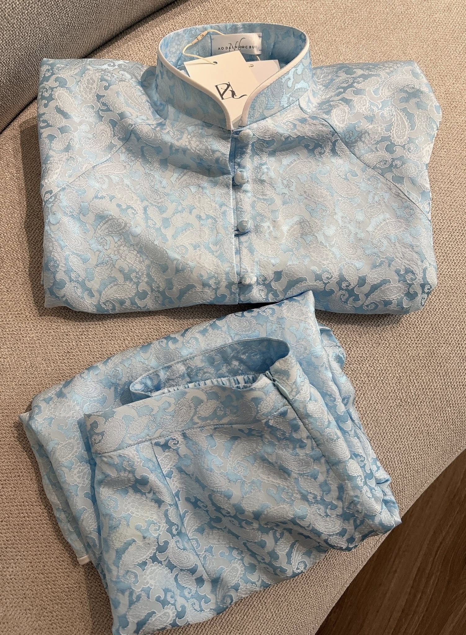 “Celestial Silk” – Wormsilk Modern Áo Bà Ba in Sky Blue with Pleated Sleeve - flat lay display by Ngoc Bui