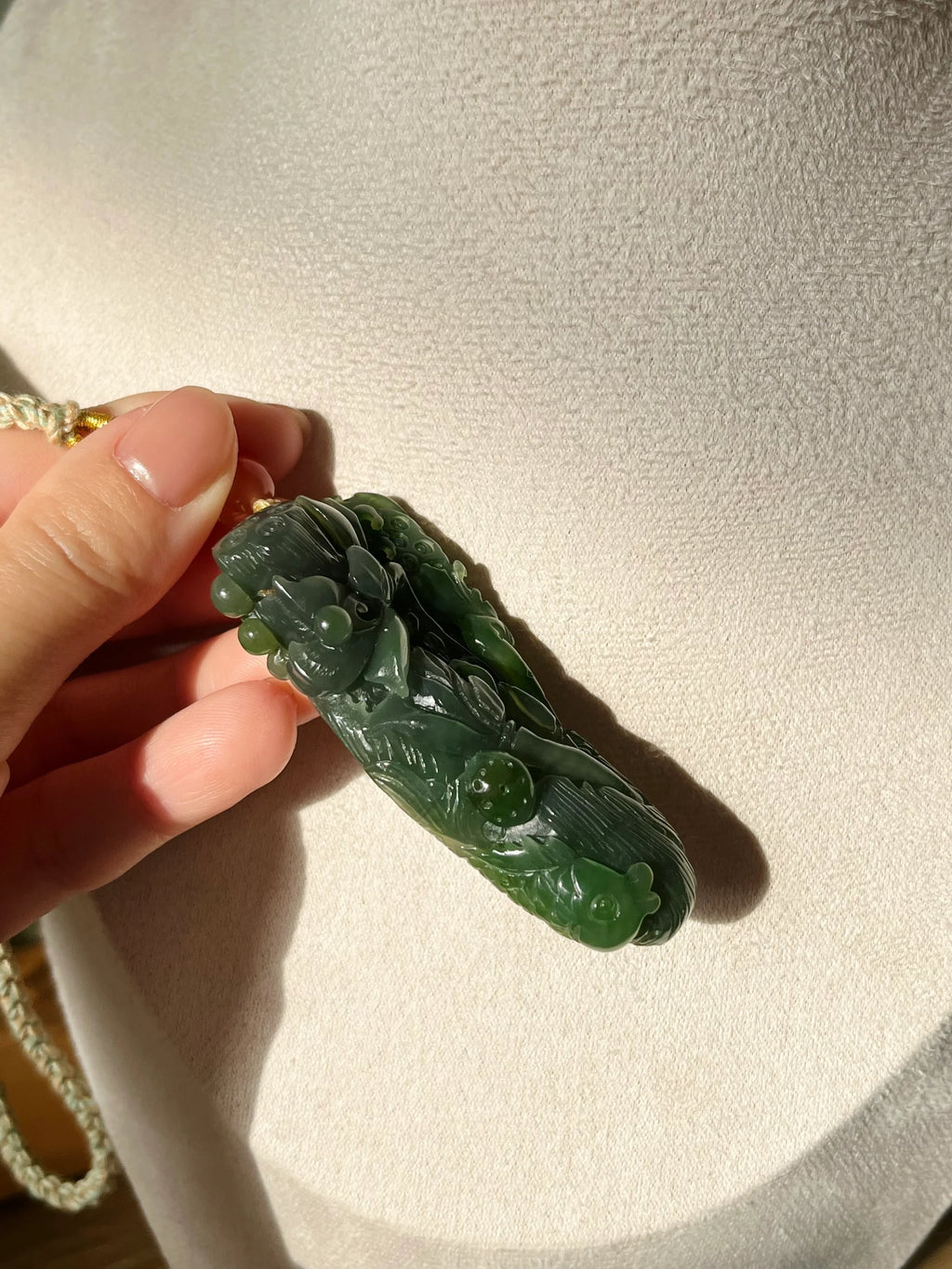 “Lotus Blessing ”- Hand Carved Green Hetian Jade Fish and Lotus Pendant, 手雕碧玉荷花鱼手把件 - detail close-up by L'Orient Haus