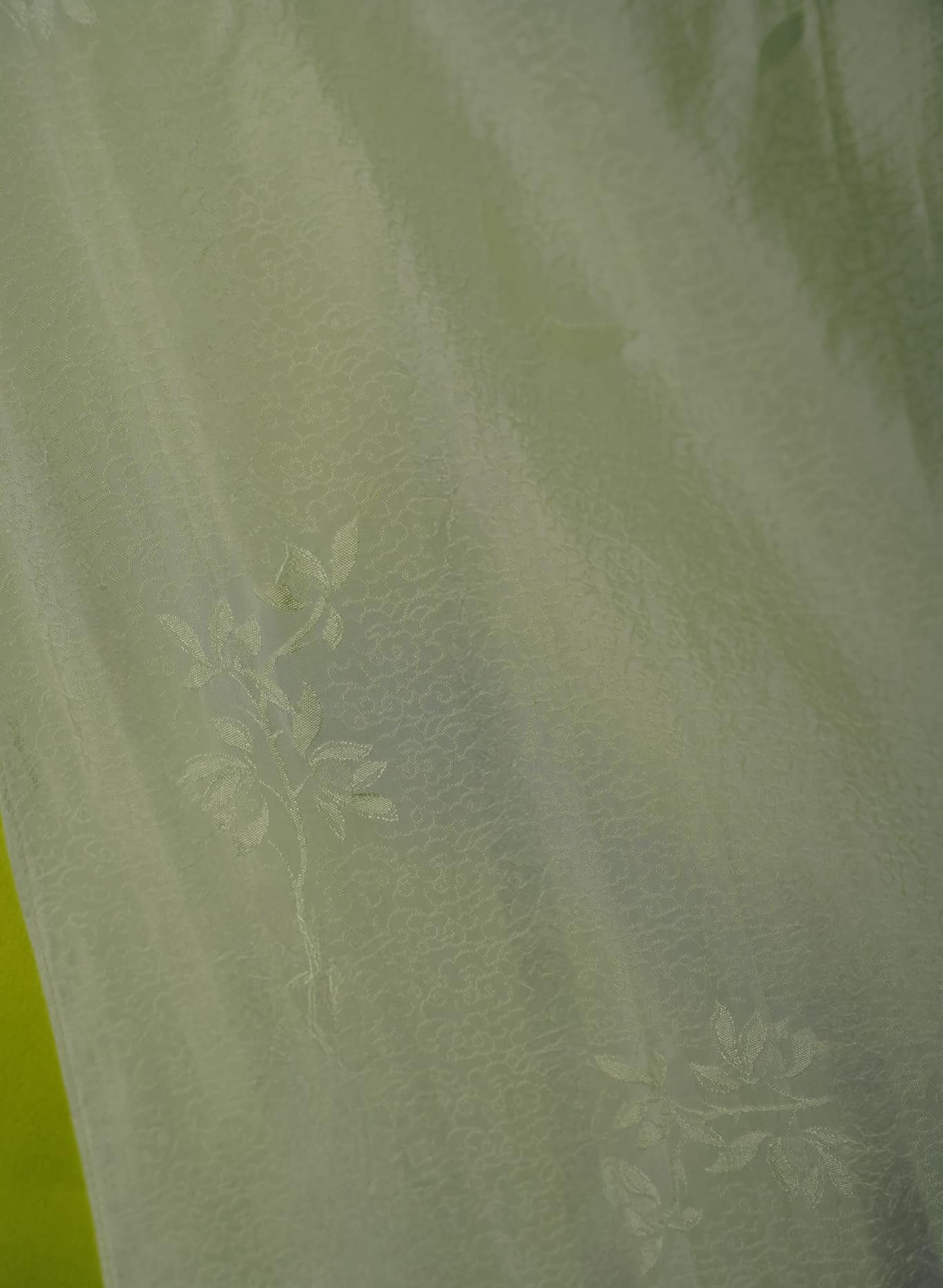 "Lan Ngoc Ao dai set in light avocado silk with modern woven pattern, traditional Vietnamese dress by Lalin."