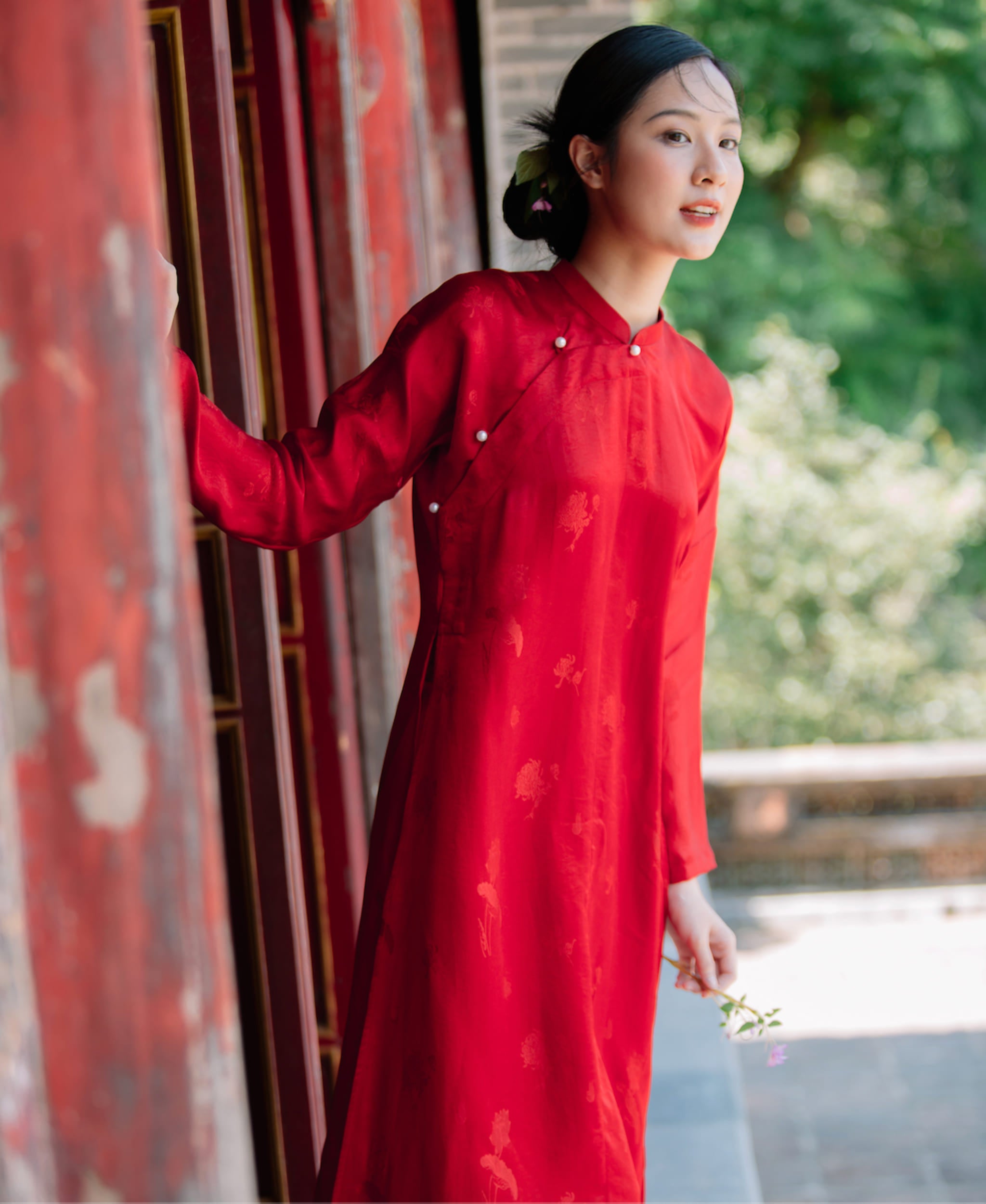"Traditional Vietnamese Ao Dai set 'Ngu Than' in red silkworm silk by Moc, featuring artisan woven patterns."