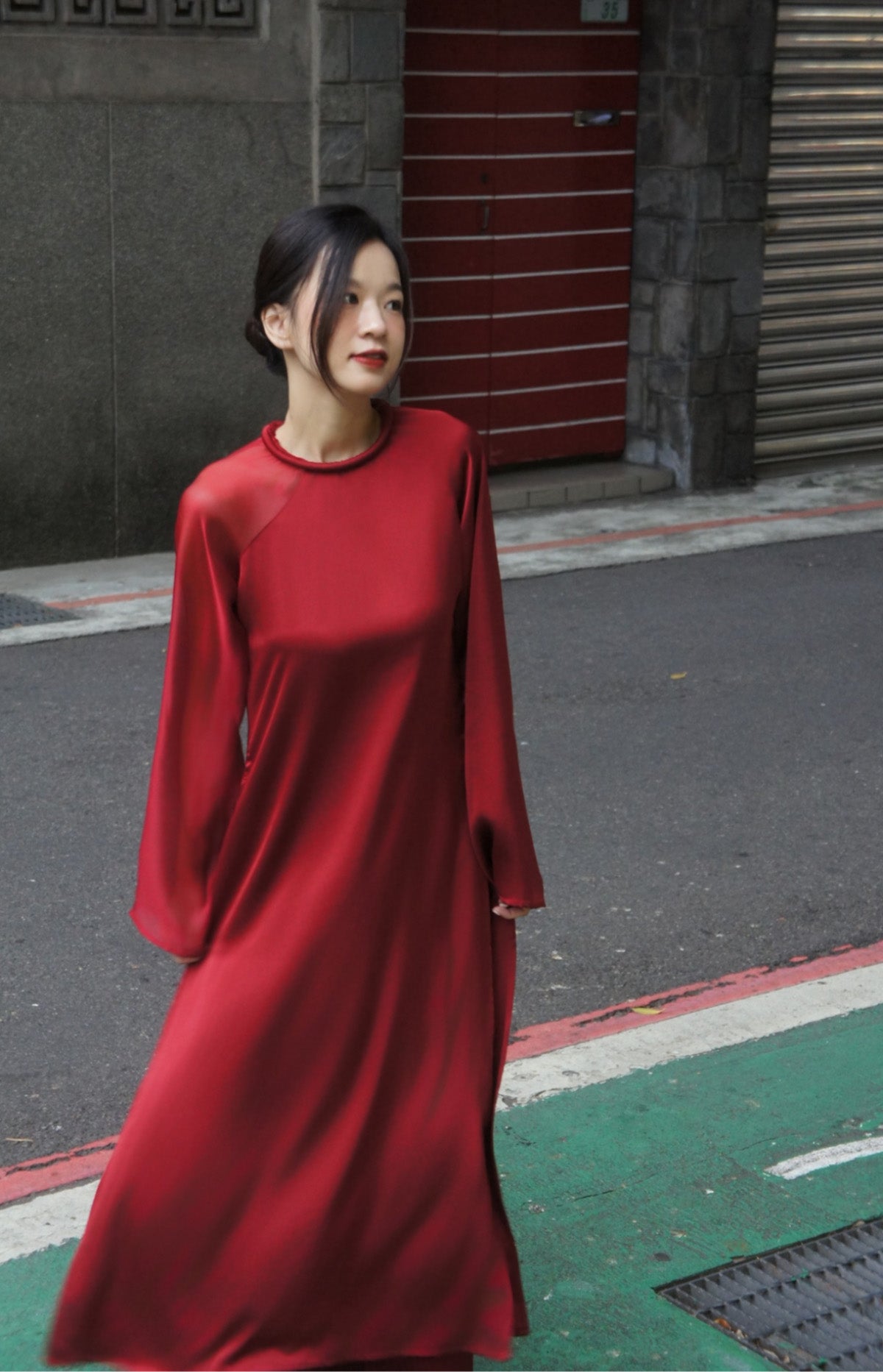 "Crimson silk Ao Dai set, modern Vietnamese dress by UoM, cultural elegance"