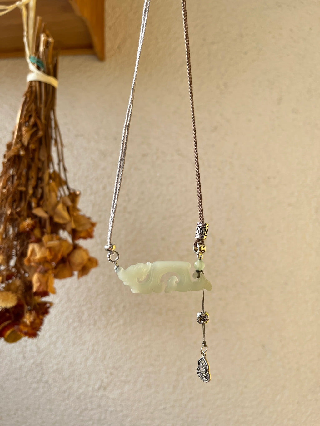 Traditional Motif - Celestial Dragon – Hand-Carved Nephrite Jade Necklace - side profile in green by L'Orient Haus